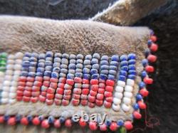 NATIVE AMERICAN BEADED LEATHER MEDICINE BAG with CONE FRINGES, PORT-092307922