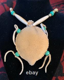 Native American beaded leather turtle on a necklace of leather, bone & beads