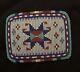 Native American beaded multi-colored belt buckle with buckskin backing
