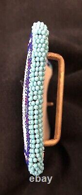 Native American beaded multi-colored belt buckle with buckskin backing