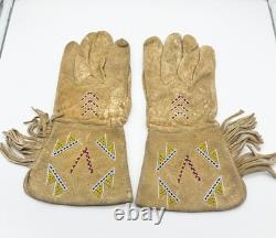 Pair of Northern Plains Indian Beaded Gauntlet gloves Early 20th century Pair of Northern Plains Indian Beaded Gauntlet gloves Early 20th century