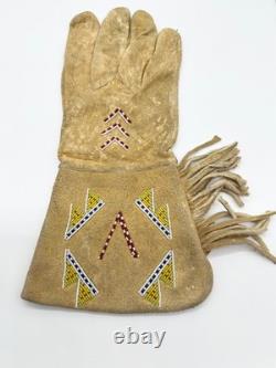 Pair of Northern Plains Indian Beaded Gauntlet gloves Early 20th century Pair of Northern Plains Indian Beaded Gauntlet gloves Early 20th century