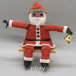 ZUNI BEADED SANTA ON WOOD BENCH by LEATRICE CELLICION-NATIVE AMERICAN BEADWORK